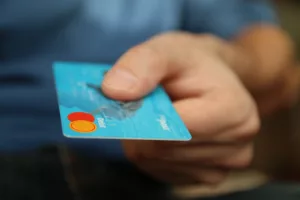User with reloadable debit card