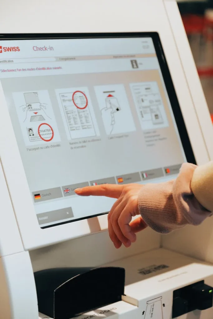 Digital Check-in Kiosk Being Used by Woman